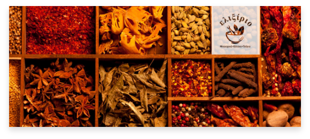 a variety of greek herbs and spices put in wooden boxes